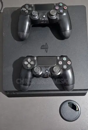 Used PlayStation 4 with 2 Controllers
