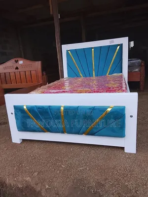 4 by 6 White and Blue Bed.