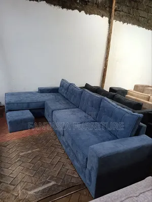 7-Seater L-Shaped Blue Sofa with Ottoman