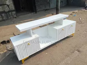 Modern White TV Console with Gold Accents