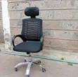 Black Ergonomic Mesh Office Chair with Headrest - 1