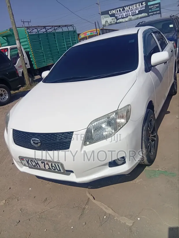 Toyota Axio 2009 Nyeupe - 1