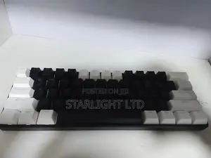 Compact Custom Mechanical Keyboard with Tuxedo Keycaps