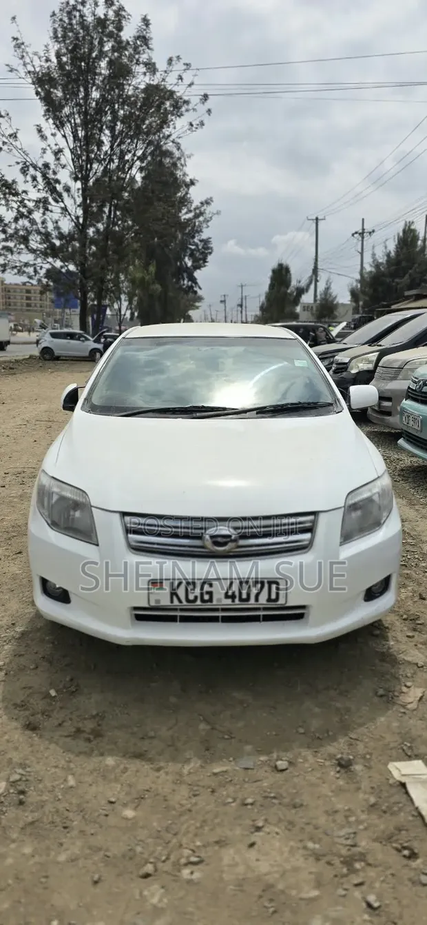 Toyota Axio 2009 Nyeupe - 1