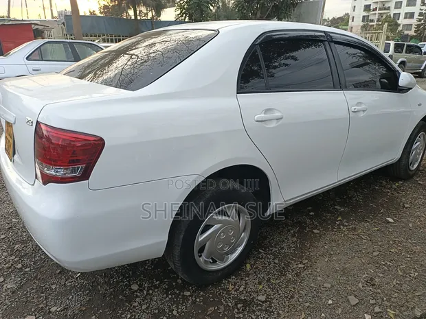 Toyota Axio 2010 Nyeupe - 1