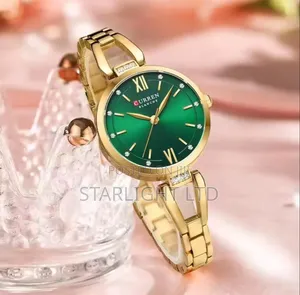 Kifahari cha Dhahabu cha Chuma cha Kutuo Kisichooza cha Quartz chenye Uso wa Kijani wa Emerald