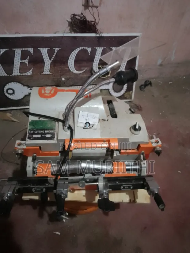 Key Cutting Machine with Key Stock and Handle - 1
