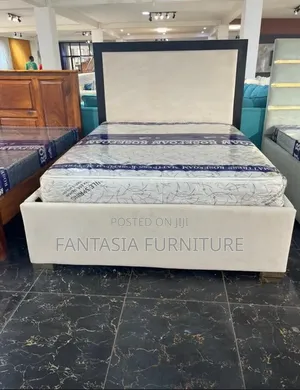 5x6 Cream Upholstered Bed with Black Wooden Frame