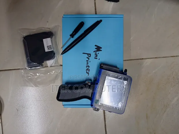 Compact Handheld Printer for Various Surfaces - 1