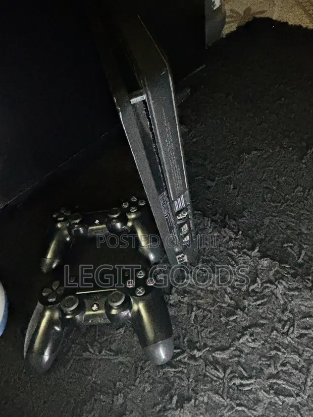 PlayStation 4 Slim with 2 Controllers - 1