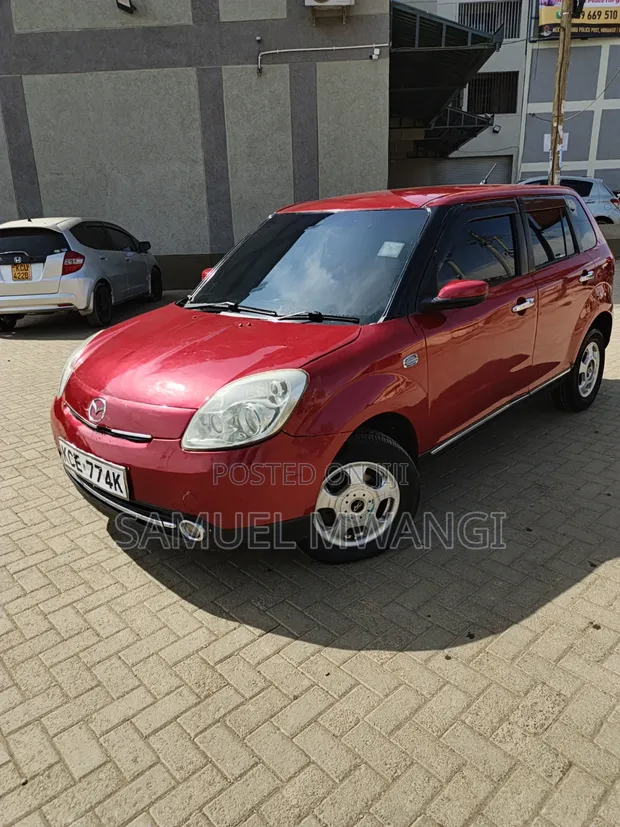 Mazda Verisa 2009 Maroon - 1