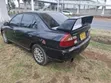 Mitsubishi Lancer 1998 Nyeusi - 4