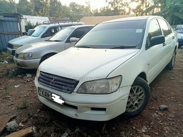 Mitsubishi Lancer 1998 Nyeupe - 1