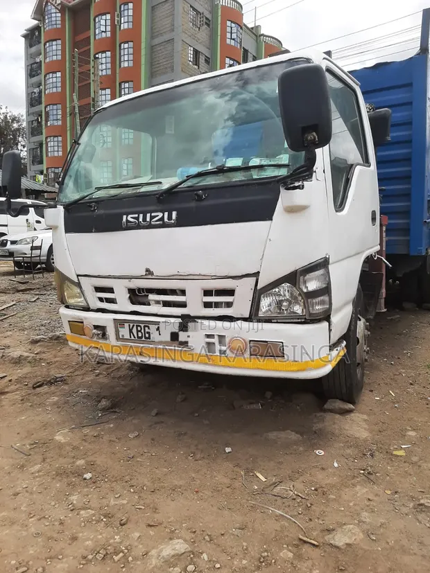 Isuzu NPR 4.3 Flatbed Truck with Crane - 1