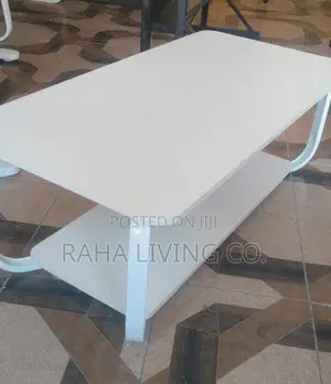 Modern White Coffee Table with Curved Legs and Lower Shelf