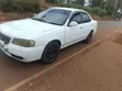 Nissan Sunny 2003 Nyeupe - 4