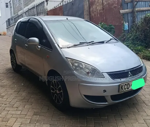 Mitsubishi Colt 2008 Nyeupe - 1