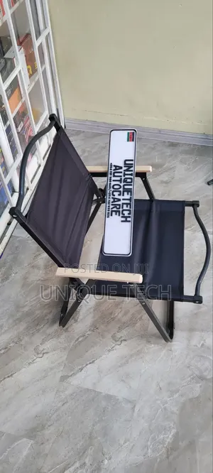 Black Portable Outdoor Chair with Light Wooden Armrests