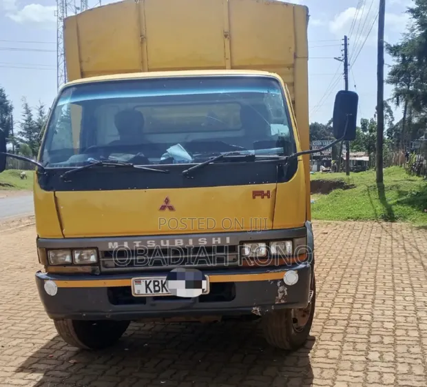 Mitsubishi FH 2009 Yellow Rigid Truck - 1