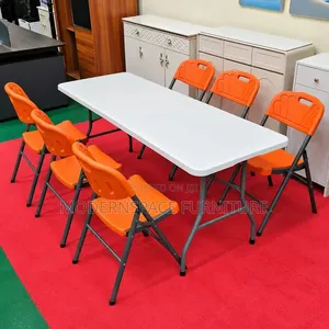 New Folding Table with Orange Chairs