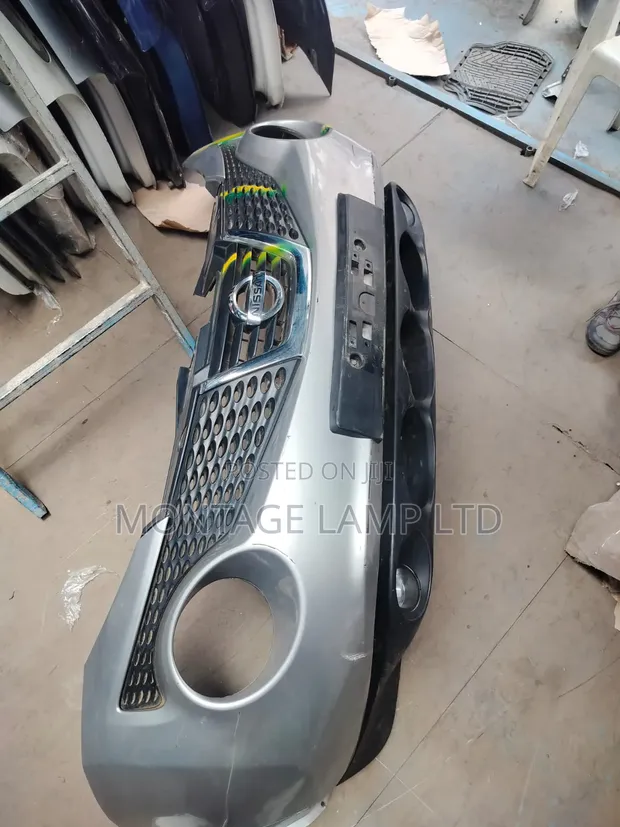 Nissan Juke 2012 Front Bumper with Grill & Fog Lamps - 1