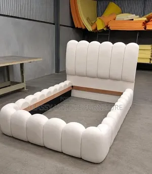 White Boucle Bed with Scalloped Headboard