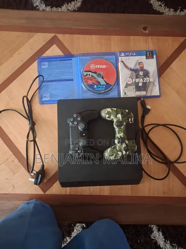 PlayStation 4 Slim 512GB with 2 Controllers & FIFA Games - 1