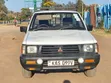 Mitsubishi L200 2004 Nyeupe - 1