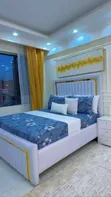 Luxury White Vertical Channel-Tufted Bed Frame with Gold Accents - 1