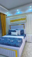 Luxury White Vertical Channel-Tufted Bed Frame with Gold Accents - 2
