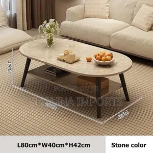 Minimalist Oval Coffee Table With a Lower Storage Shelf
