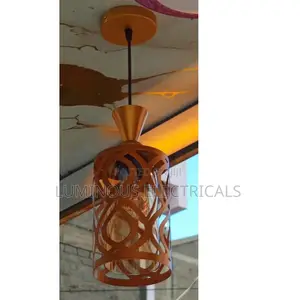 Elegant Gold Single Pendant Light with Amber Glass Shade