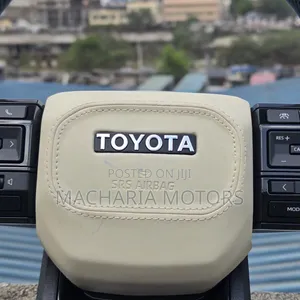 Beige & Black Aftermarket Toyota Steering Wheel with Carbon Fibre
